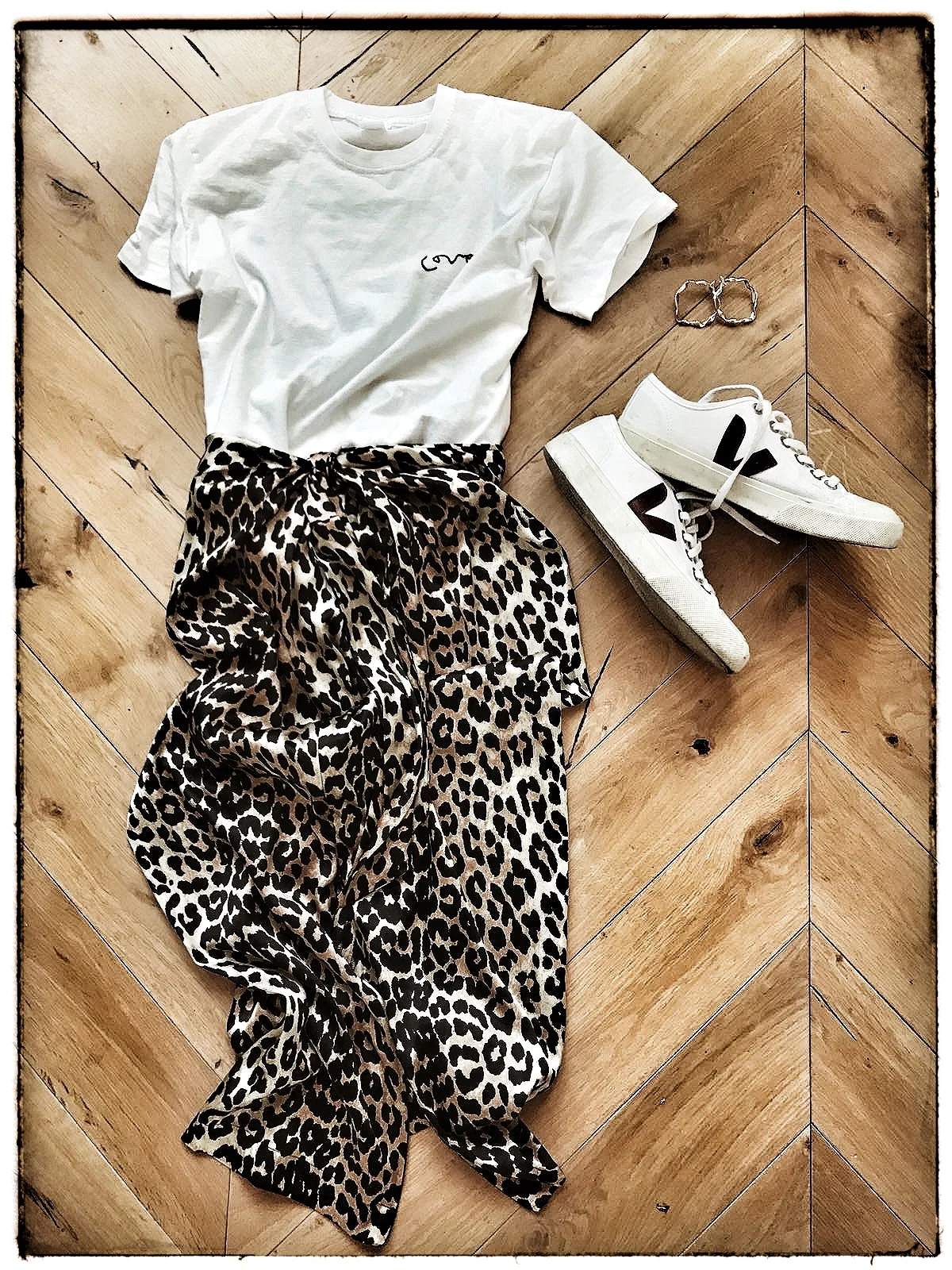 T-Short from Meylor Goods , Skirt from Ganni and trainers from Veja