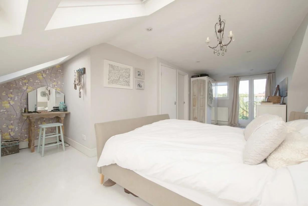 The bedroom after we had carried out an initial range of changes to tone down the satsuma floor by painting it in Farrow & Ball Strong White