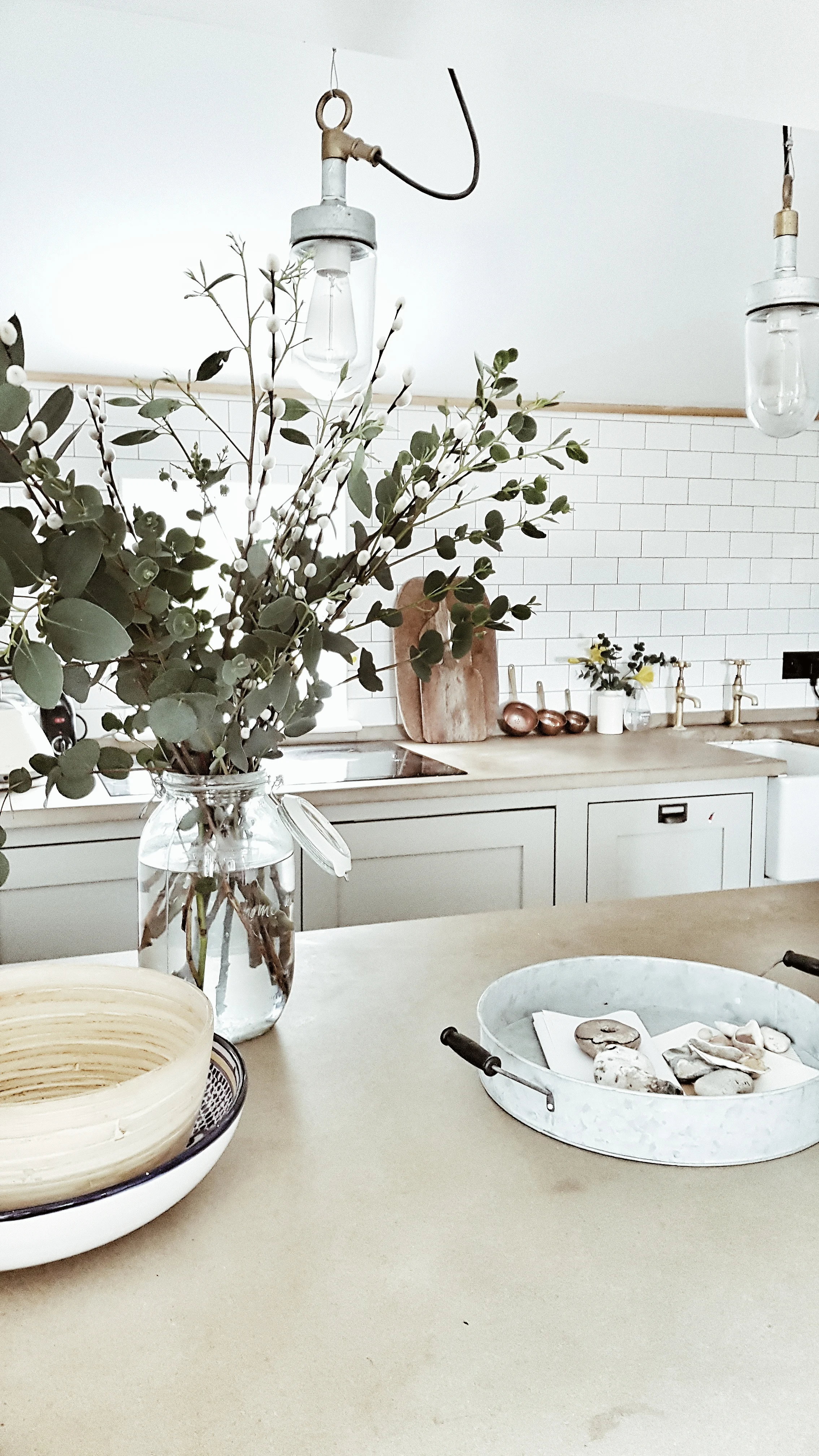 I loved the vintage industrial pendant lights hanging over the kitchen island