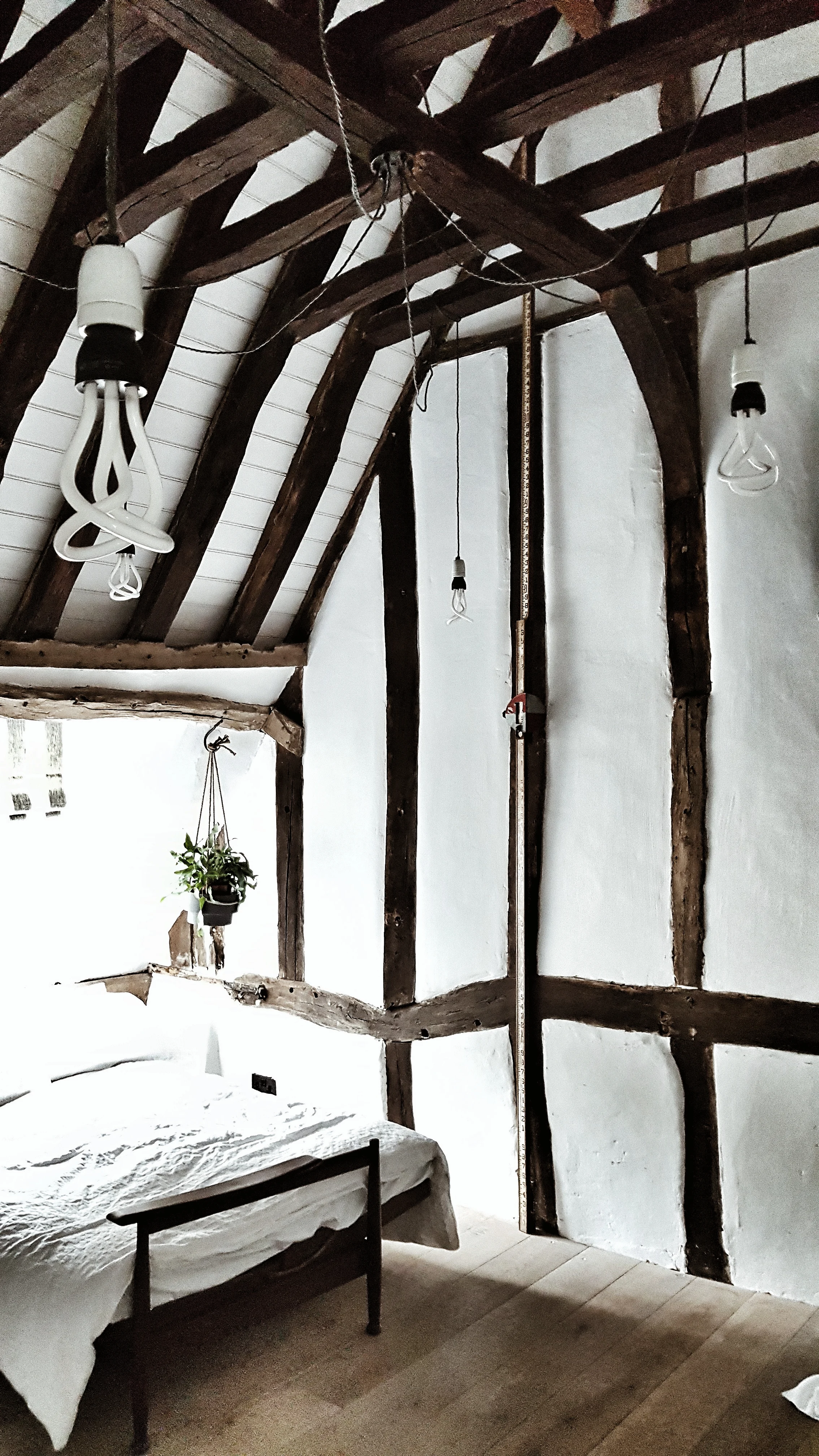 High ceilings and gorgeous exposed oak beams in the landing area. I liked the modern twist added by the contemporary bulb lights