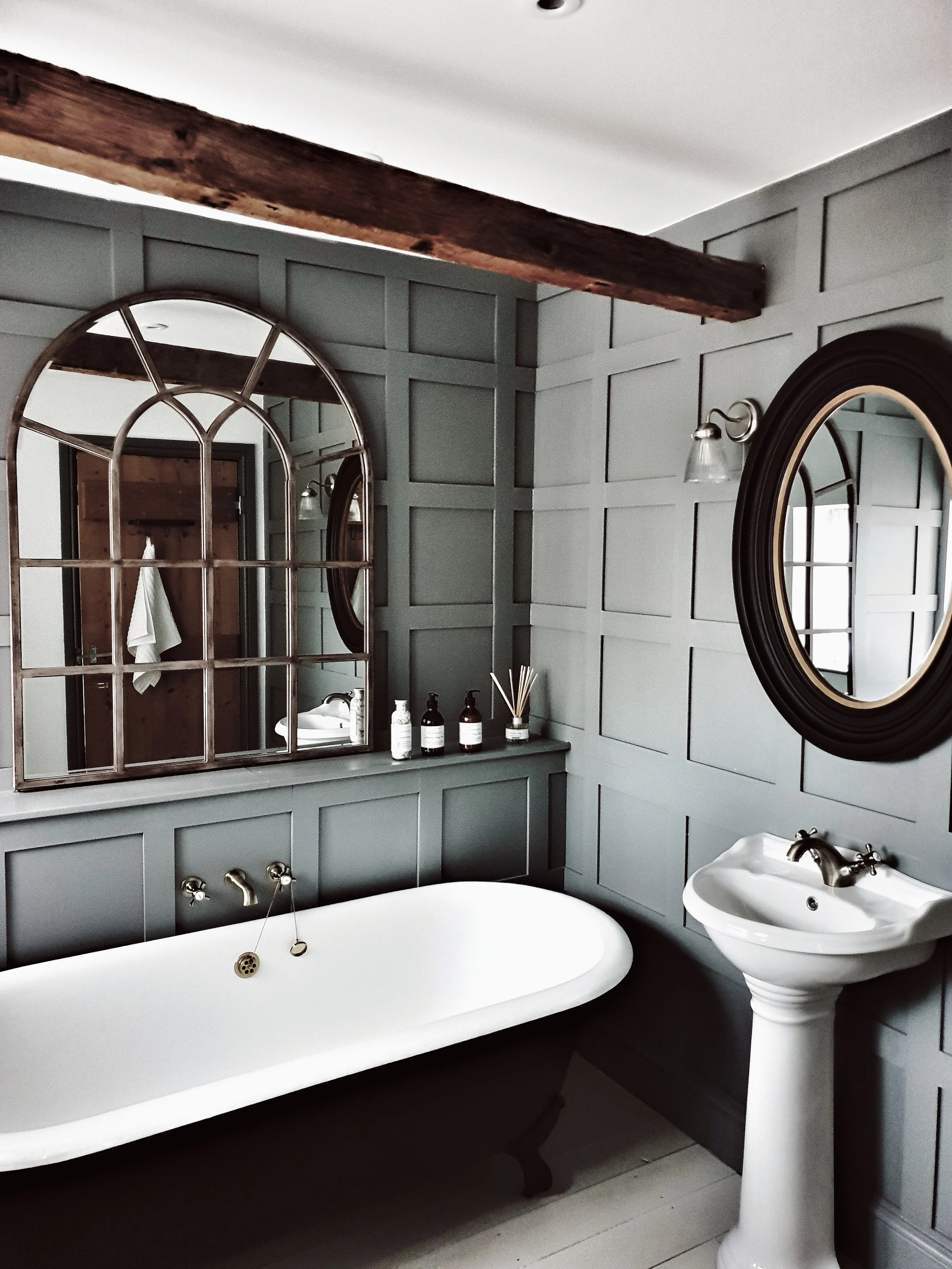 The family bathroom blends contemporary and vintage features with a huge rolltop bath to relax in