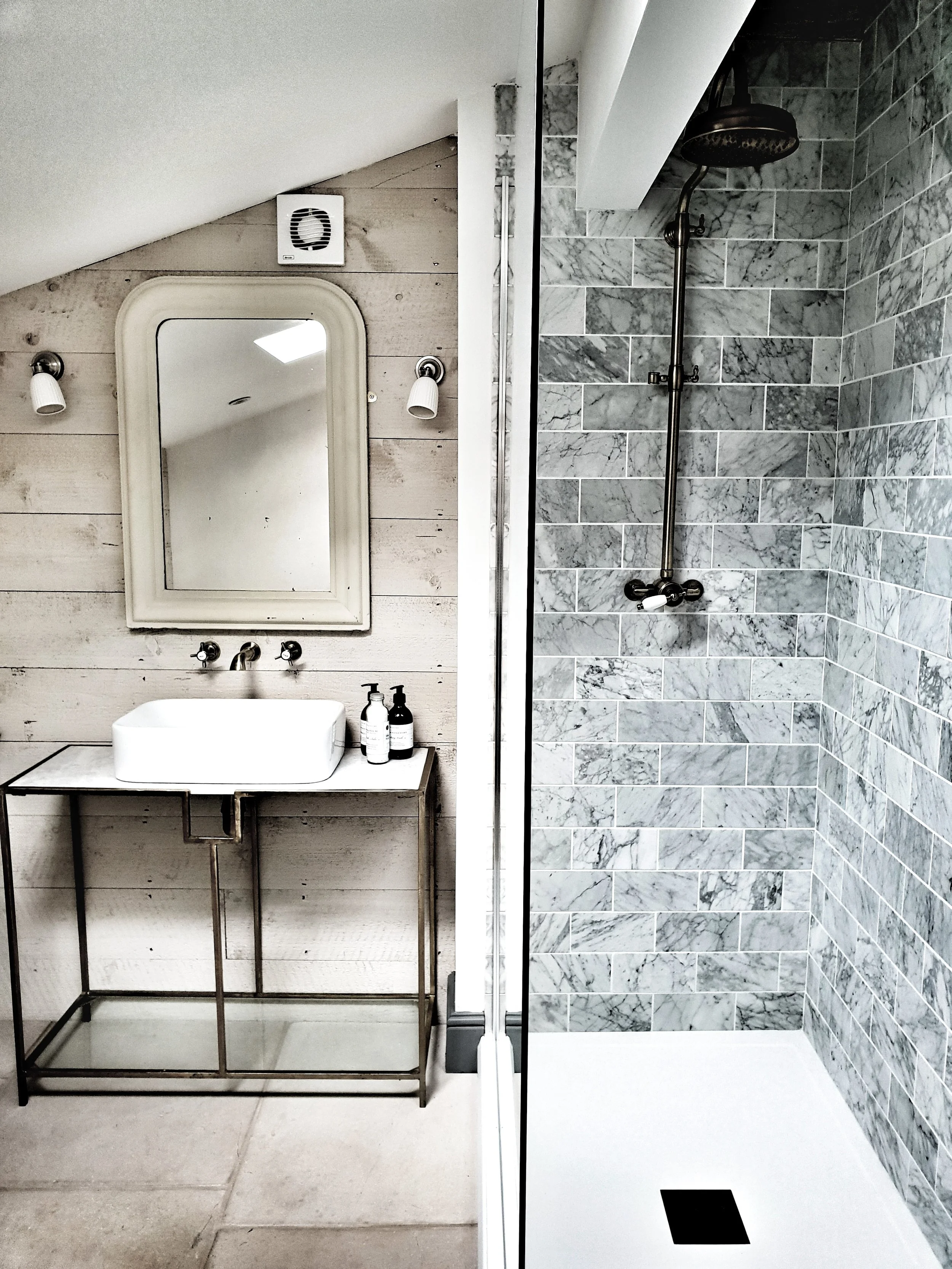 And a shower to with marble metro tiles