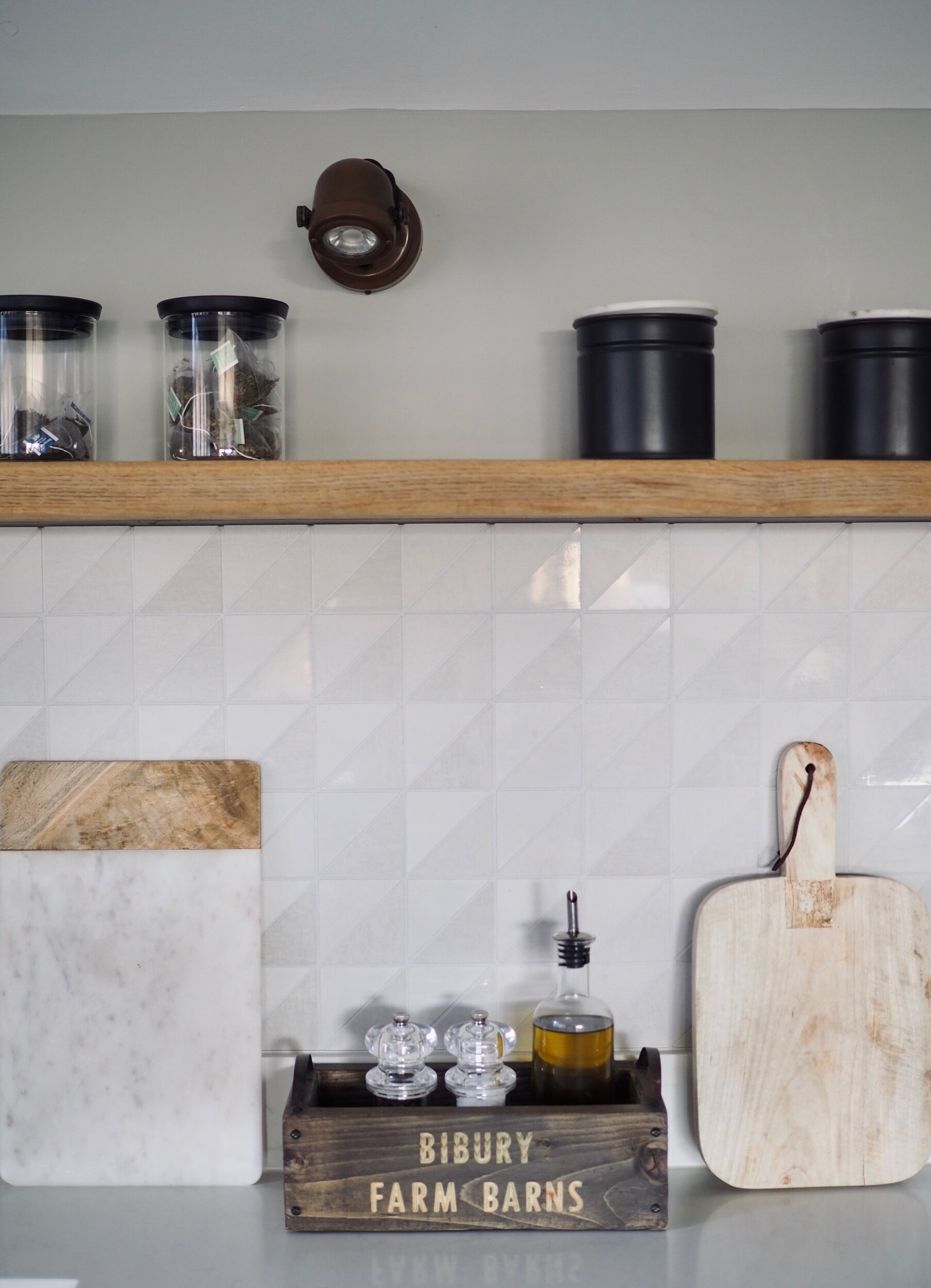 A set of white ceramic storage jars and wooden cutting boards in the  interior of an eco-friendly kitchen. minimalism. Eco items Stock Photo -  Alamy