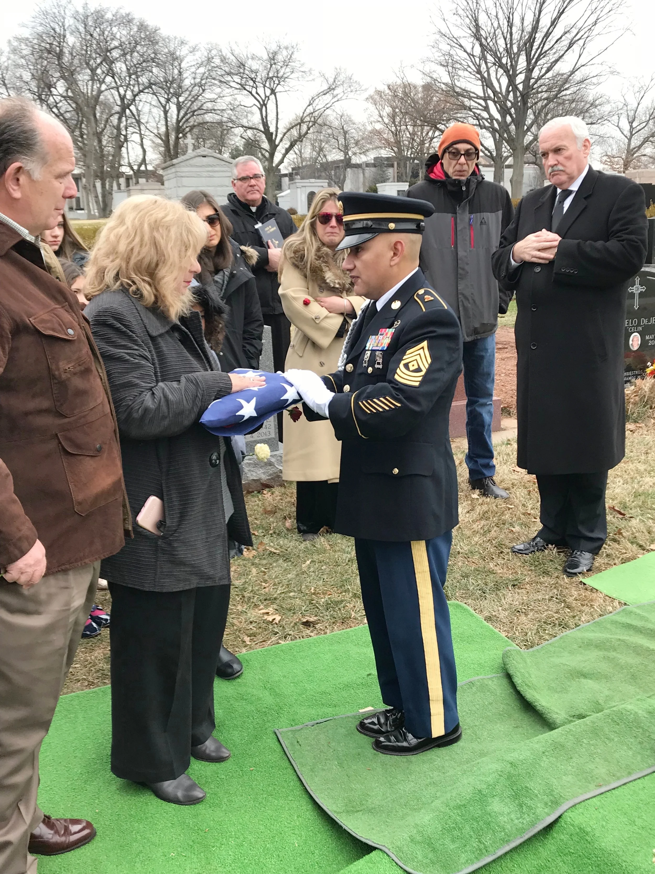 Soldier presents flag to Josie (& Joe).jpg