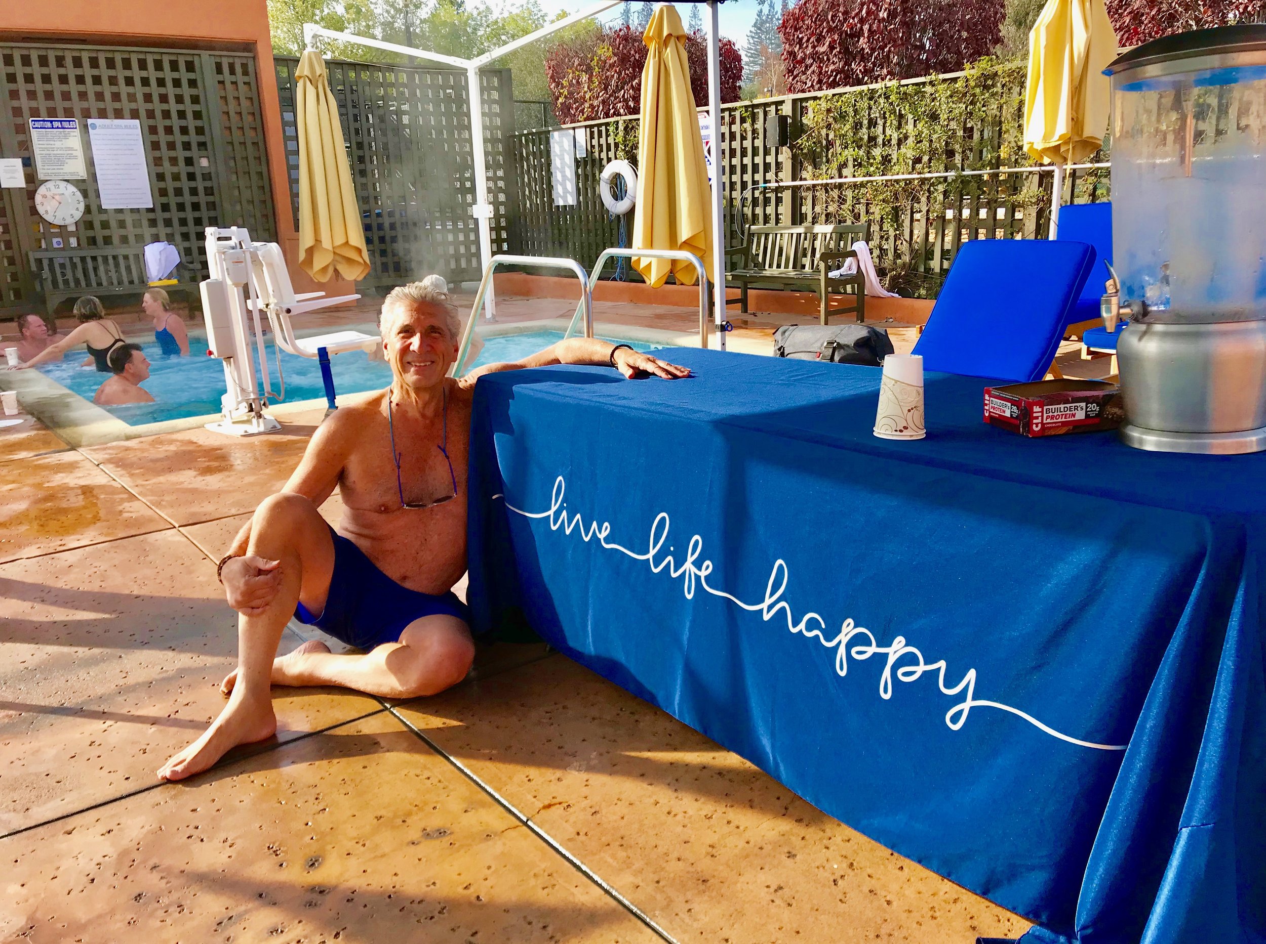 Dennis & Live Life Happy sign at pool.jpg*.jpg