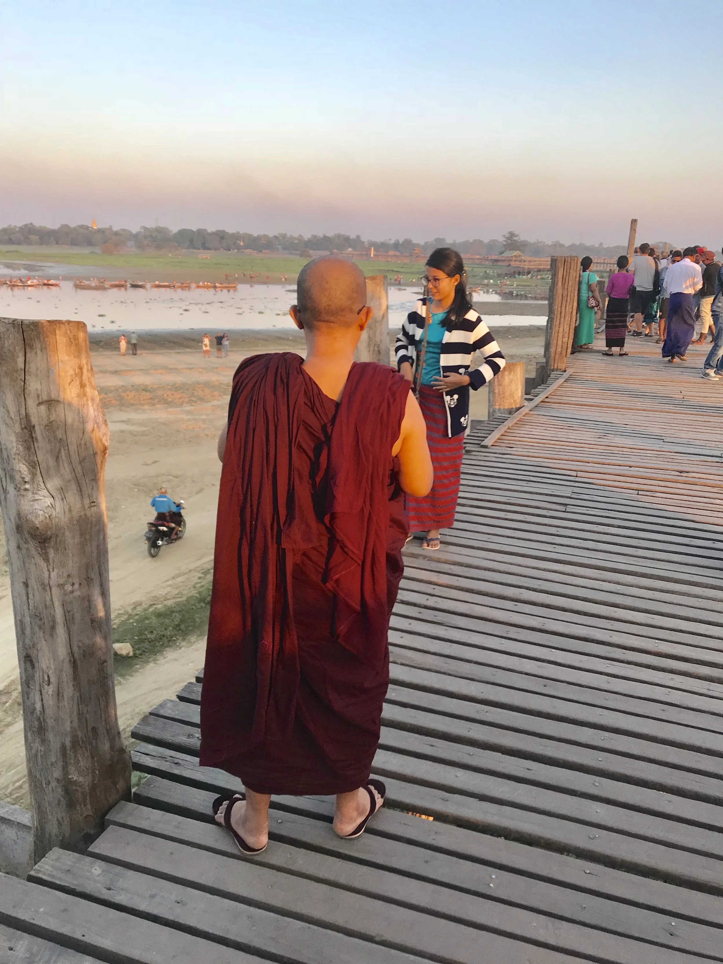 monk on bridge taking photo.jpg*.jpg