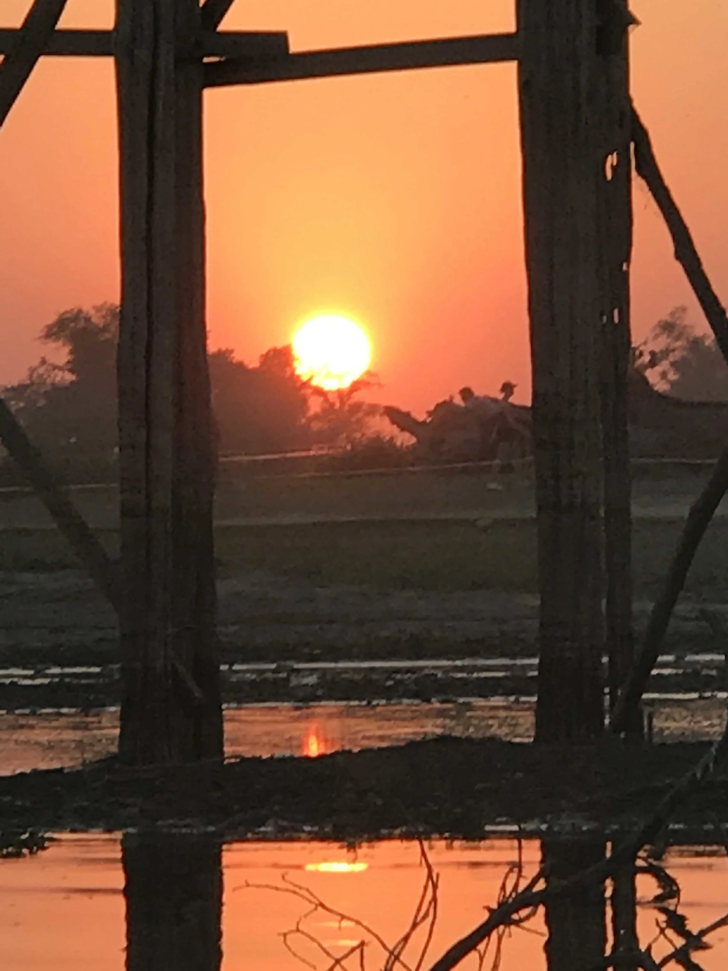 Full sunset between poles.jpg