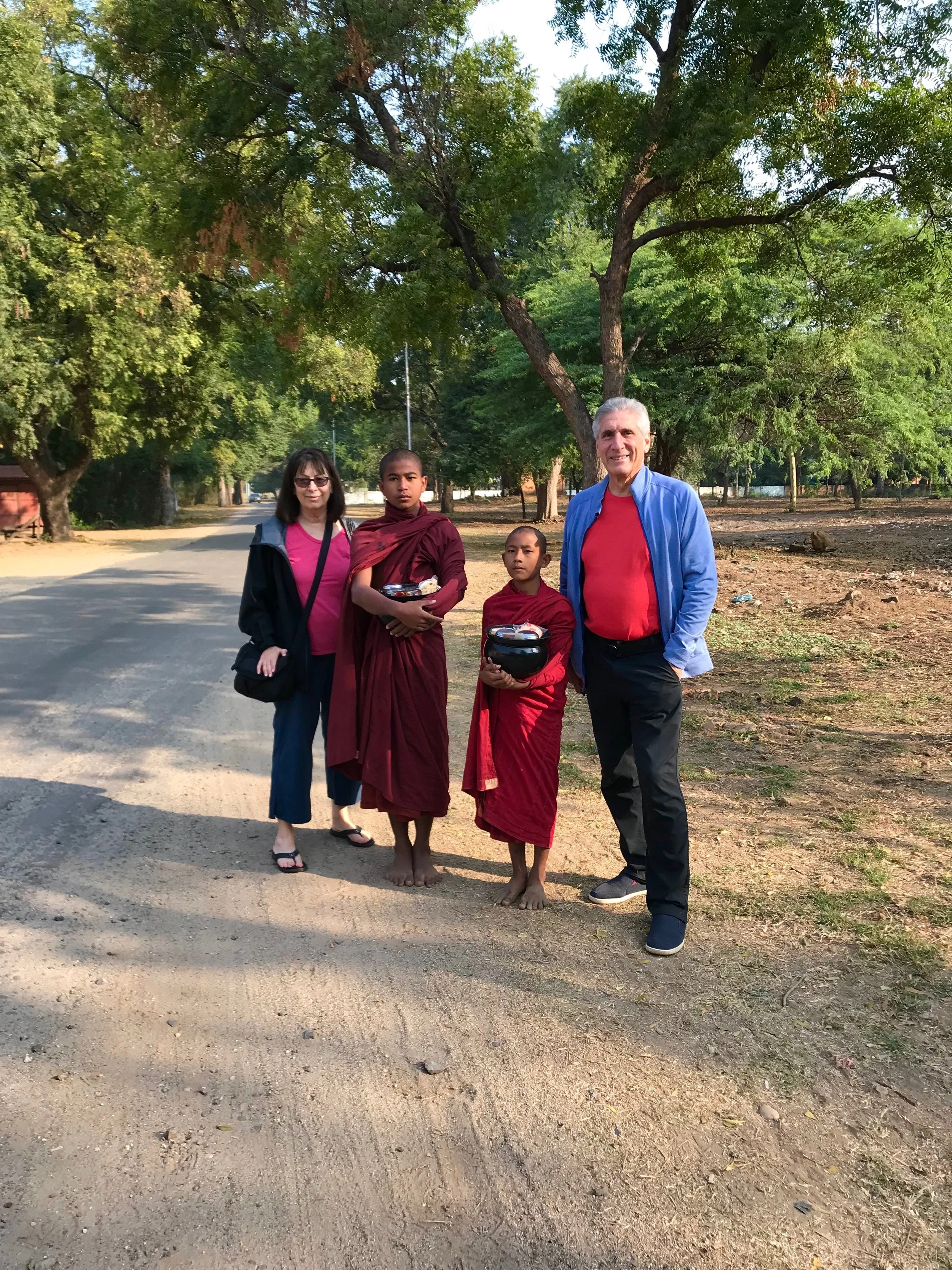 Cecile & I w young monks.jpg