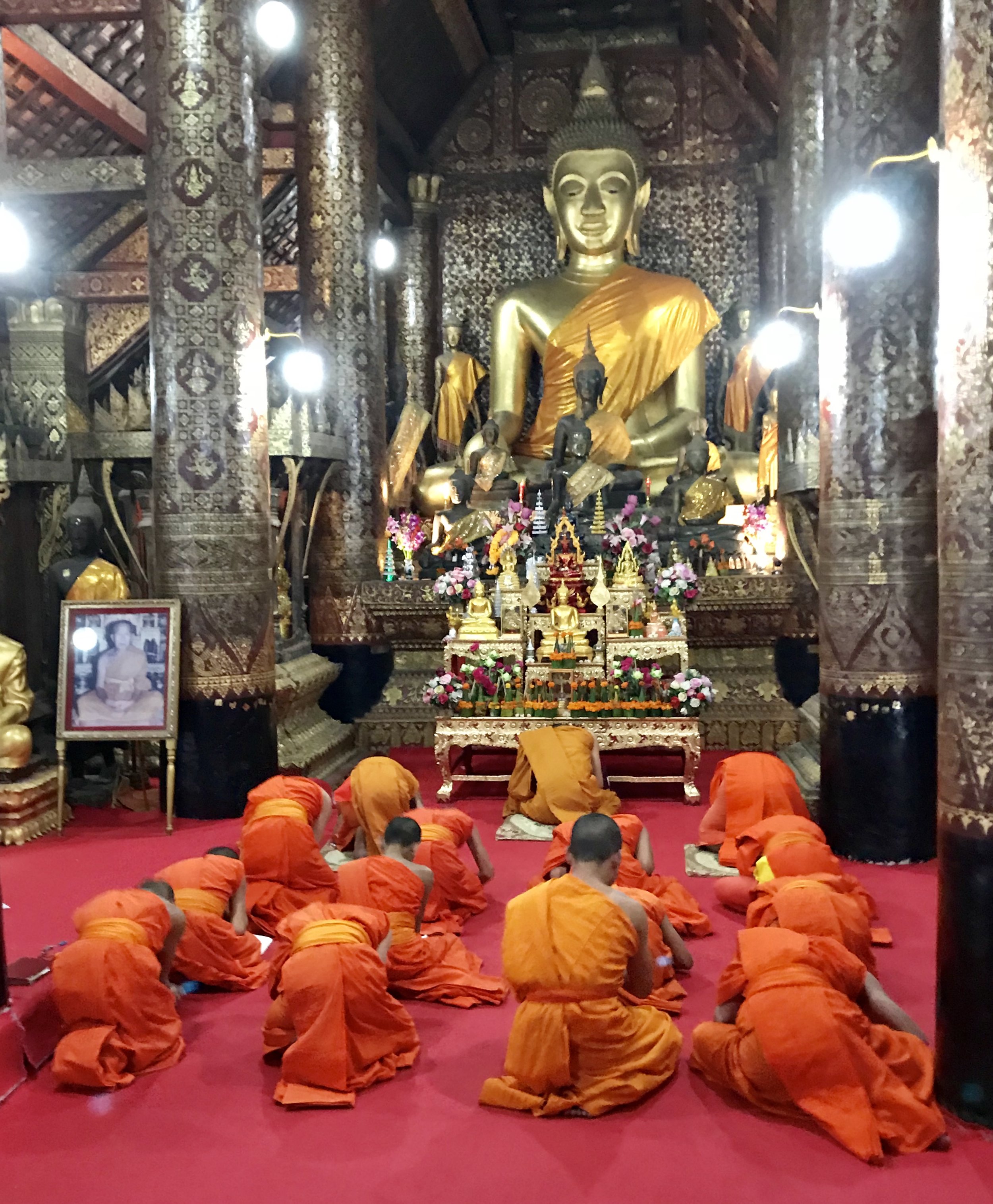 Monks bowing Buddha after chants.jpg
