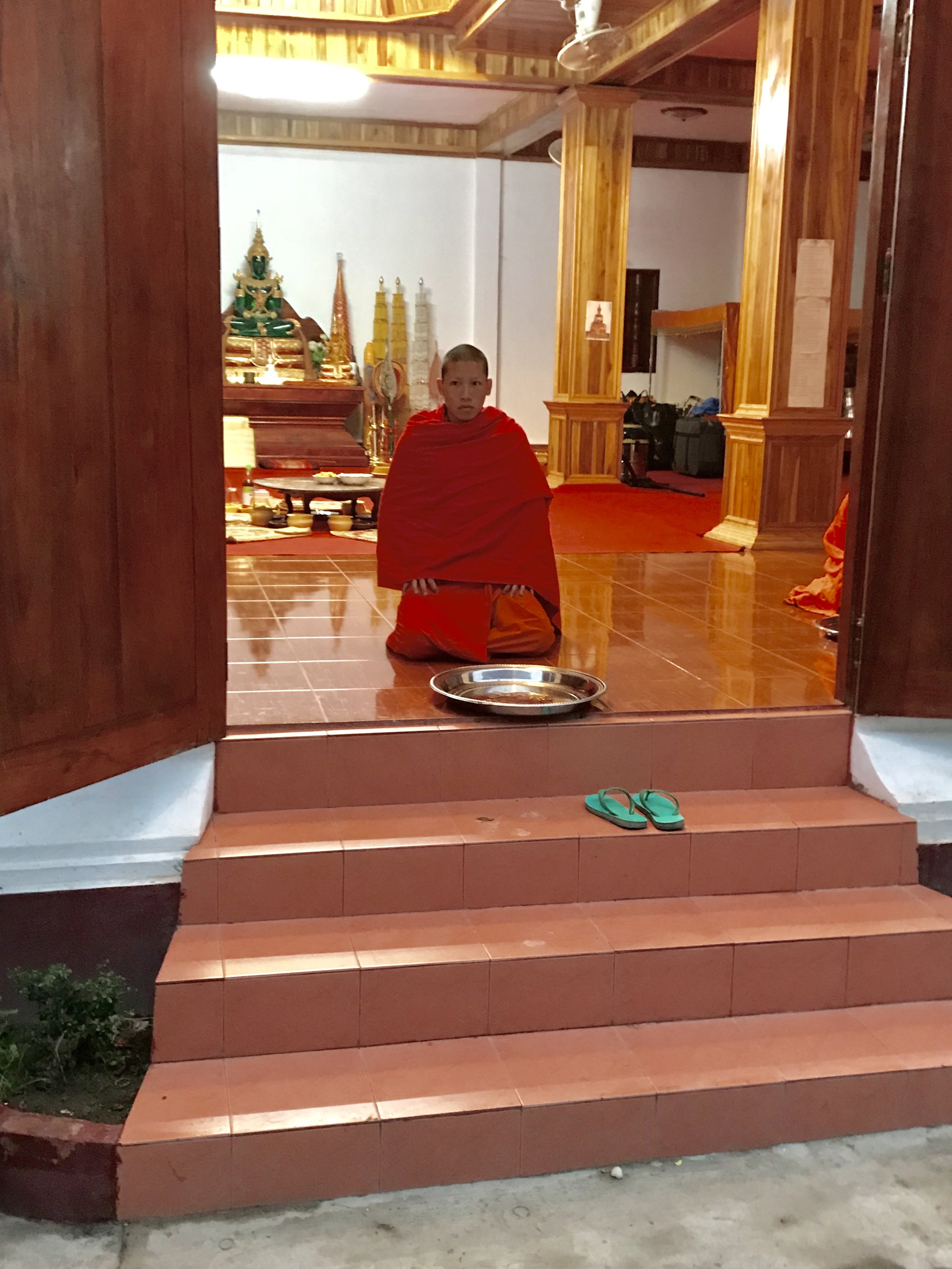 Monk at monastery threshold w platter.jpg*.jpg