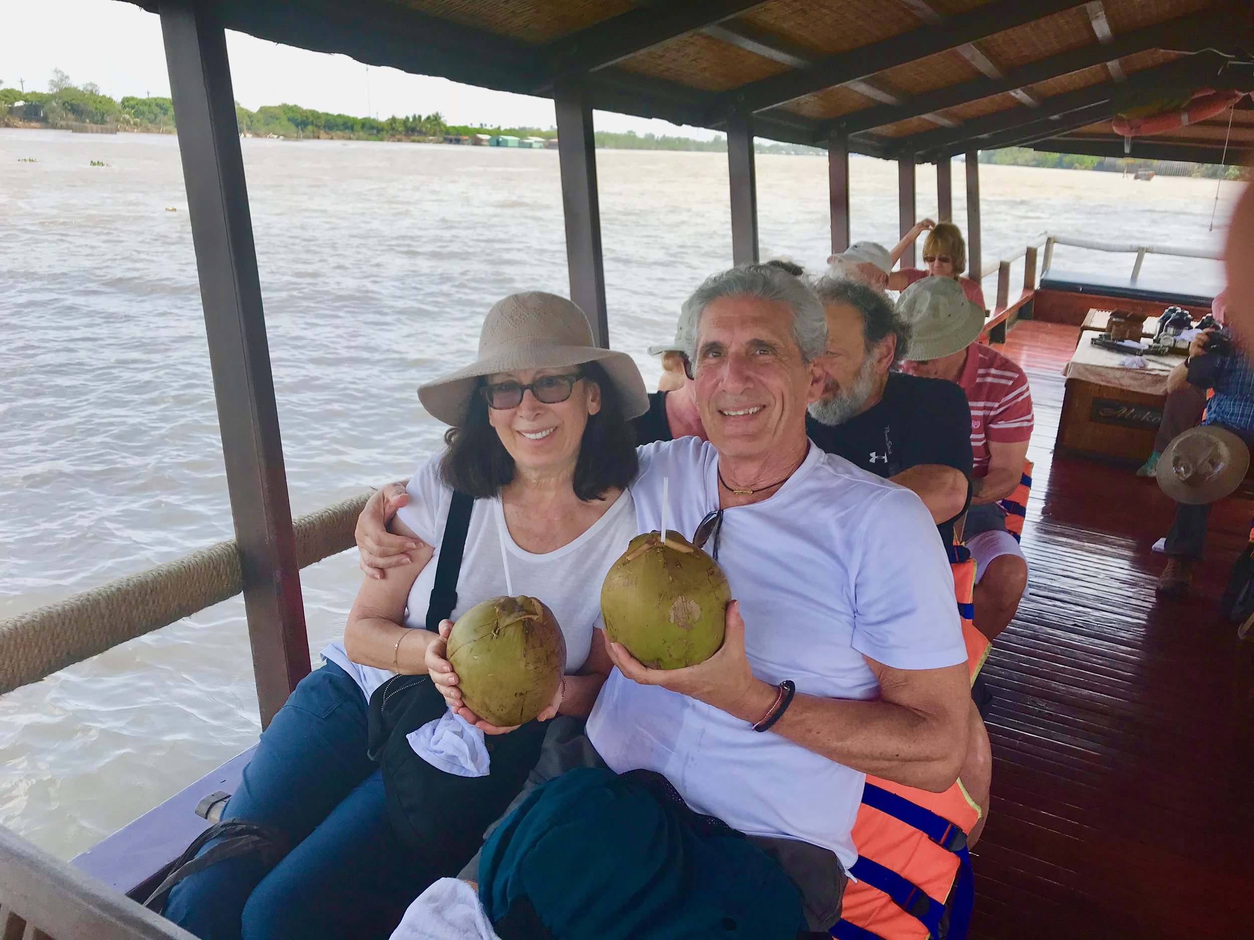 Cecile & Me drinking coconut on Paddle boat on Mekong.jpg*.jpg