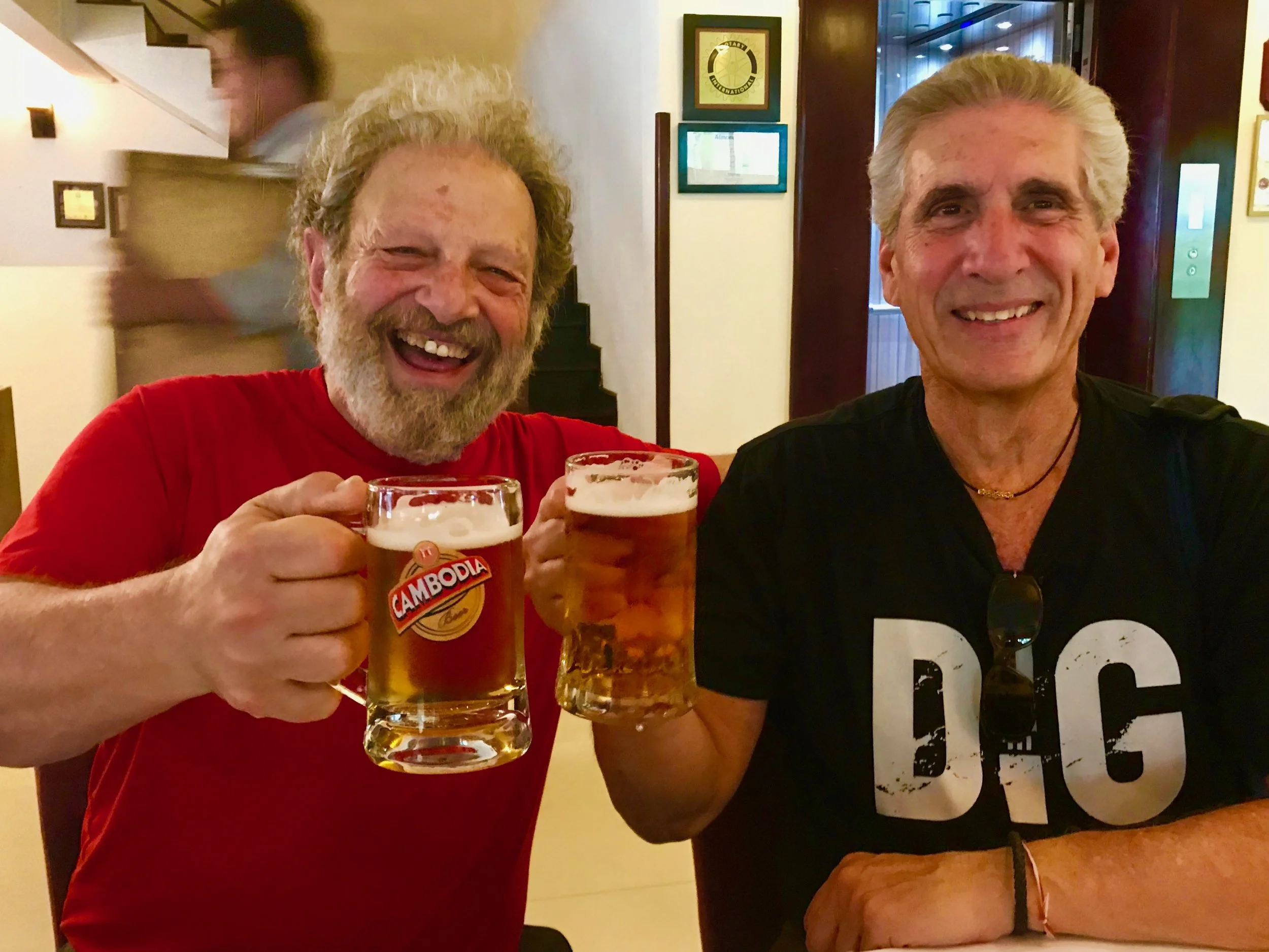 Jerry & Me Toasting w beer mug Cambodia.jpg