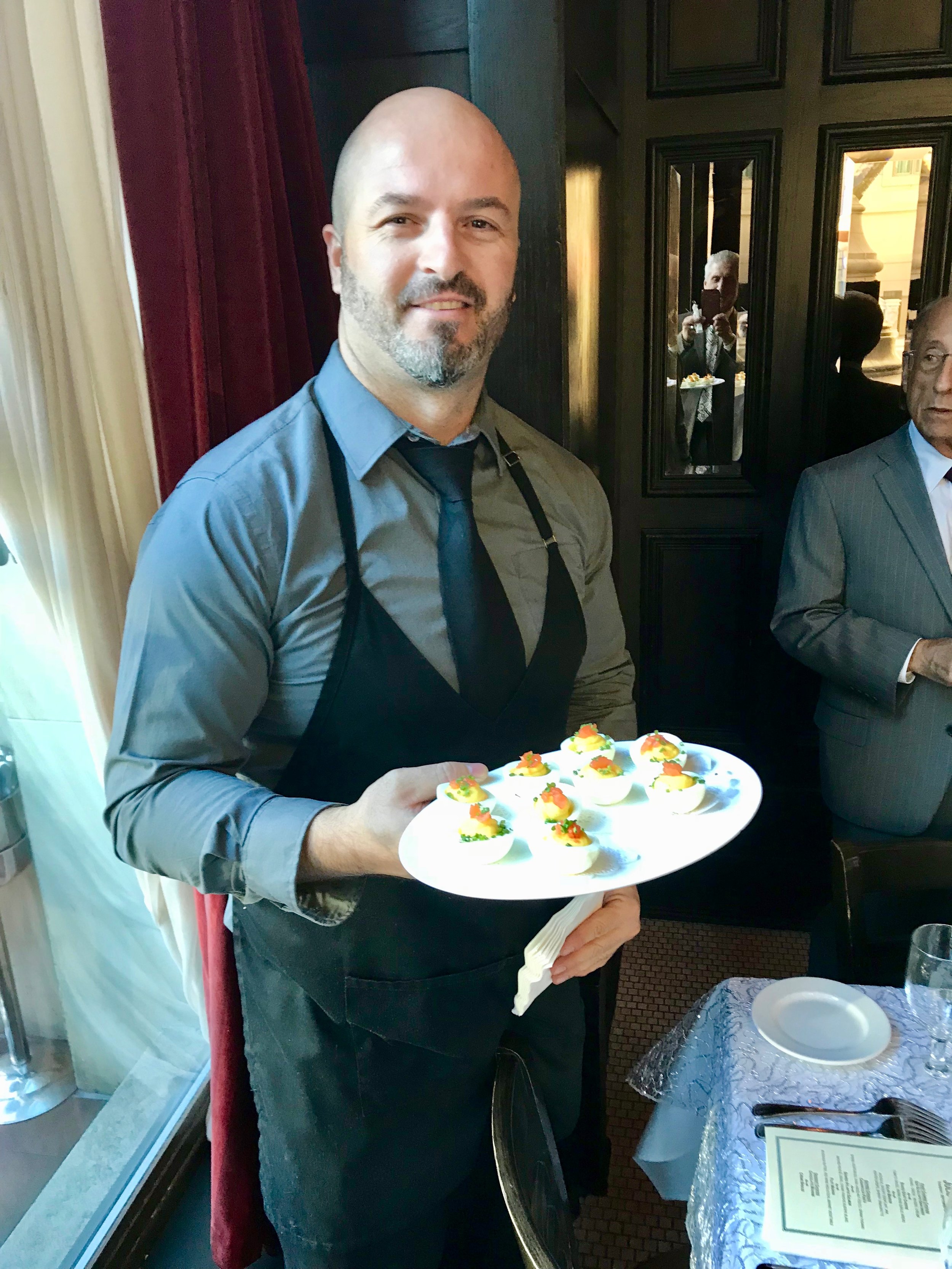 Waiter w platter deviled eggs.jpg