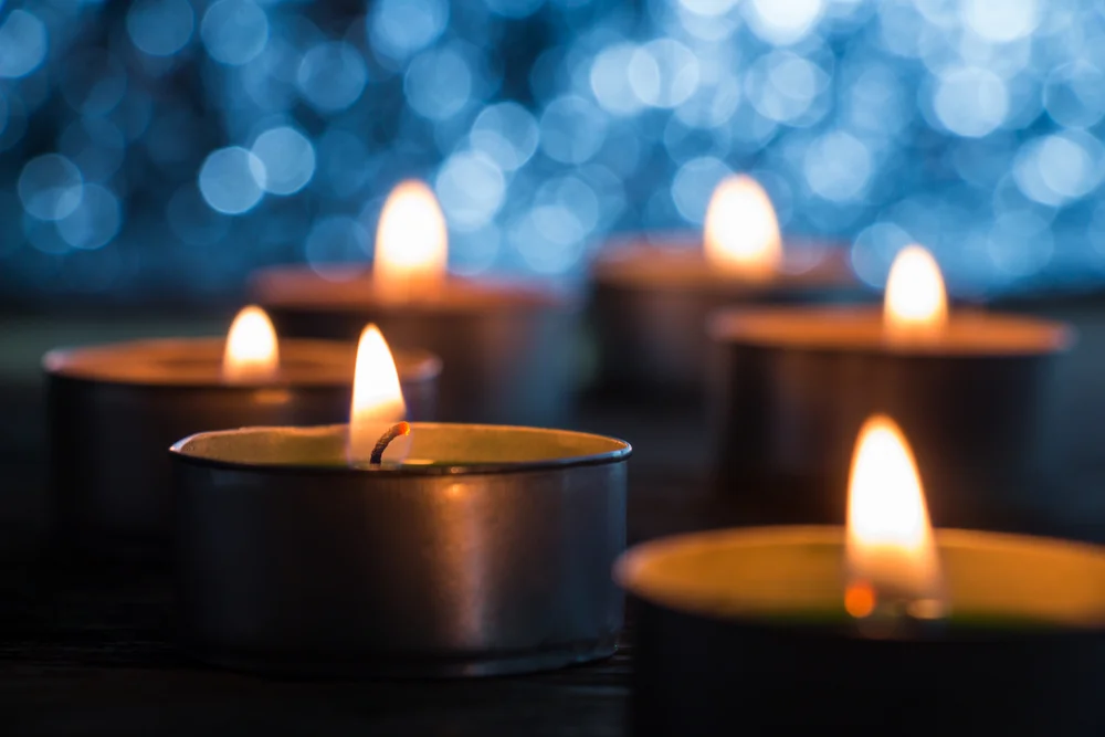 Candles lit in copper hldg cups.jpg