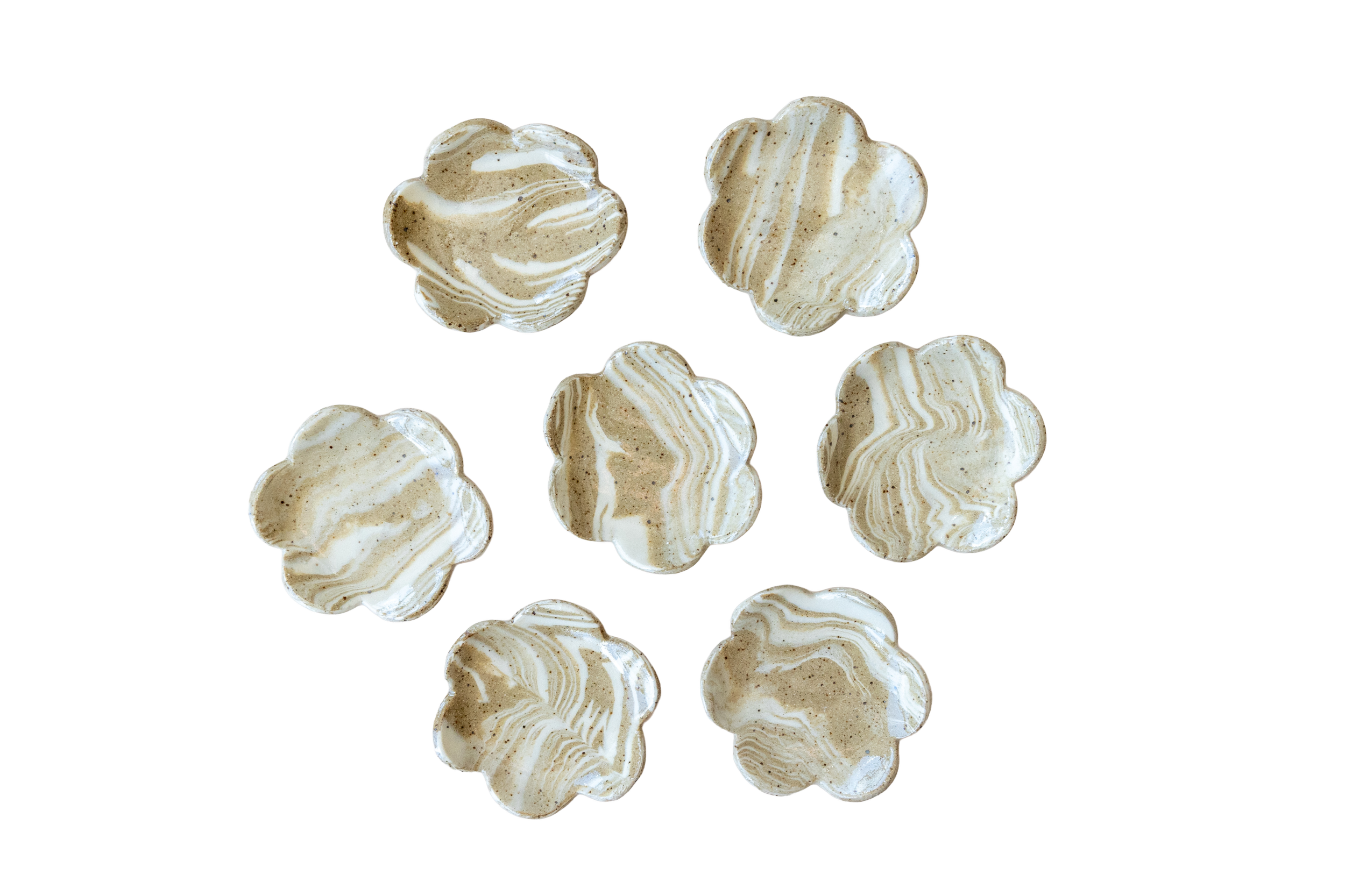 Group of marble-patterned meringue cookies with swirls of white and light brown.