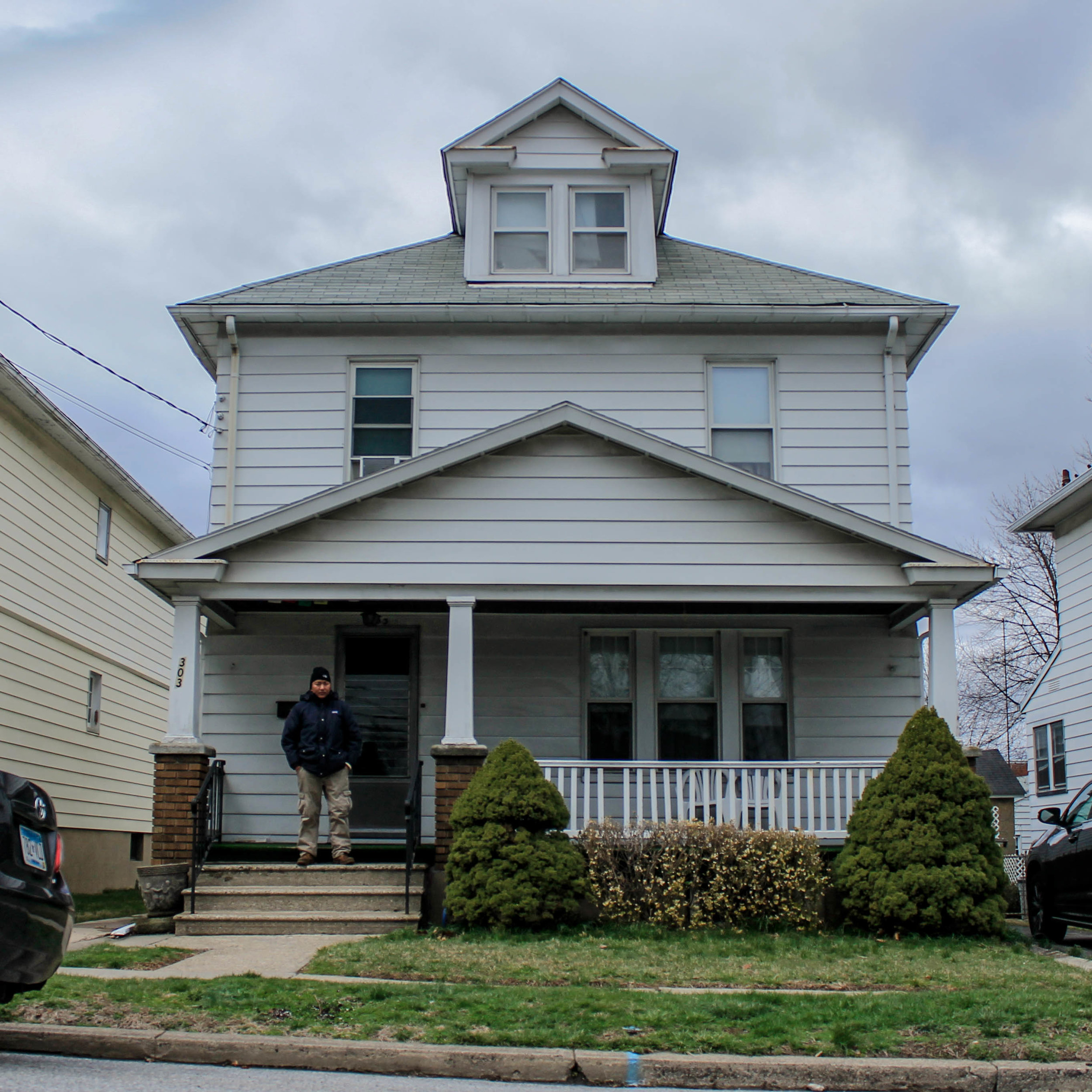  Jigme stands outside his residence in Phillipsburg, NJ. He rents a bed from a family of four.&nbsp; 