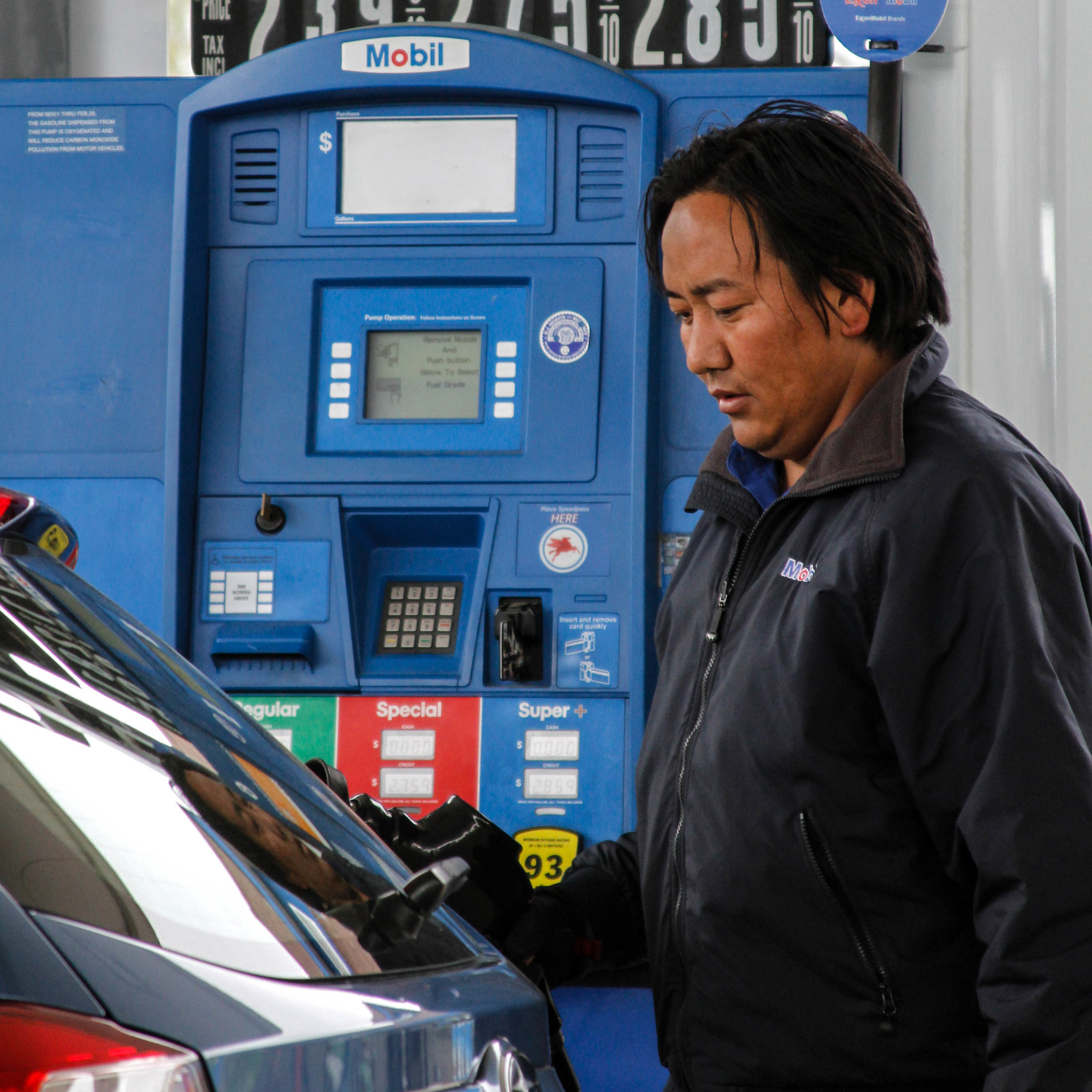  Jigme's duties often consist of pumping gas and cleaning cars. 