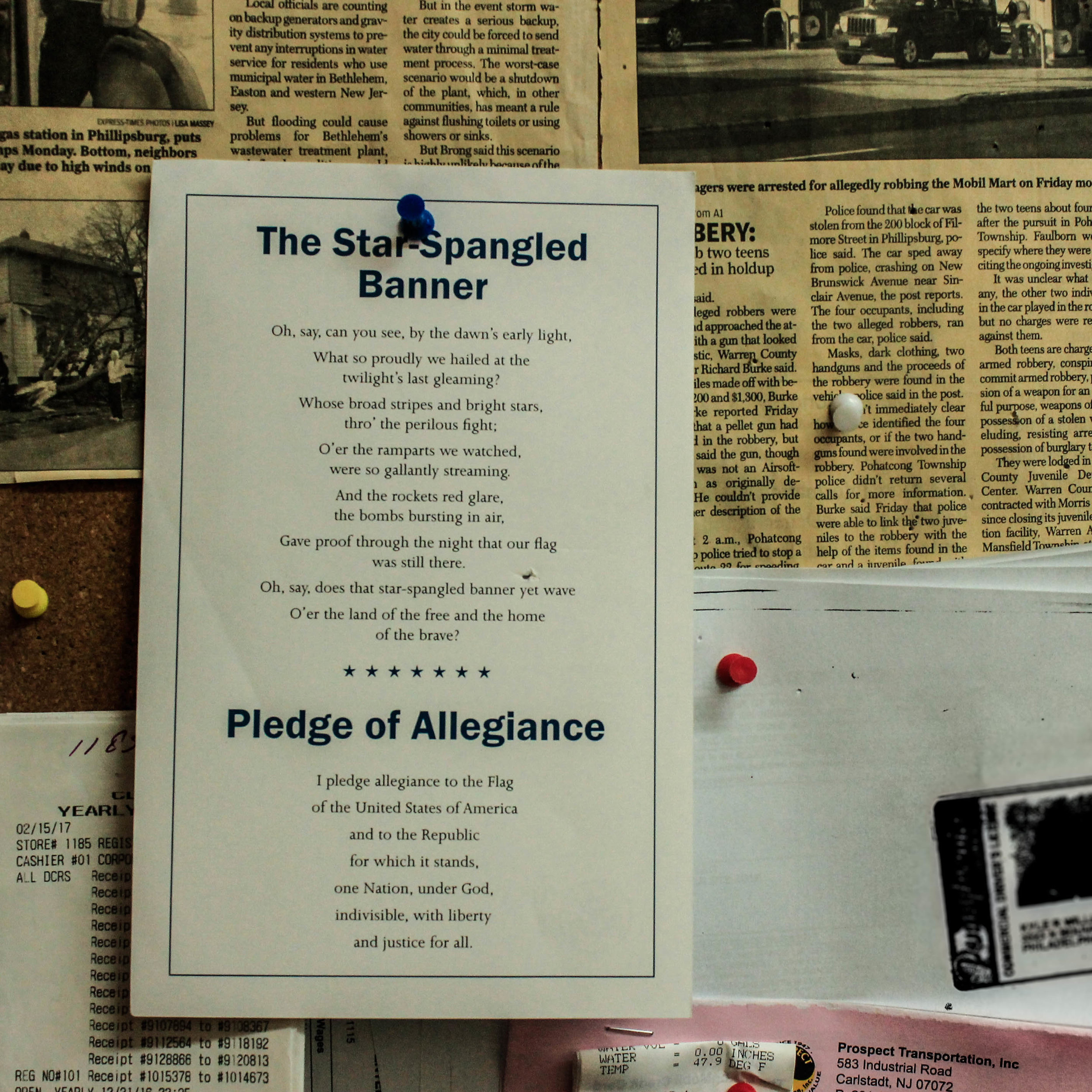  A copy of The Star-Spangled Banner and the Pledge of Allegiance hang in the office of the Mobil Gas station's supervisor, who is also a Nepali immigrant. 