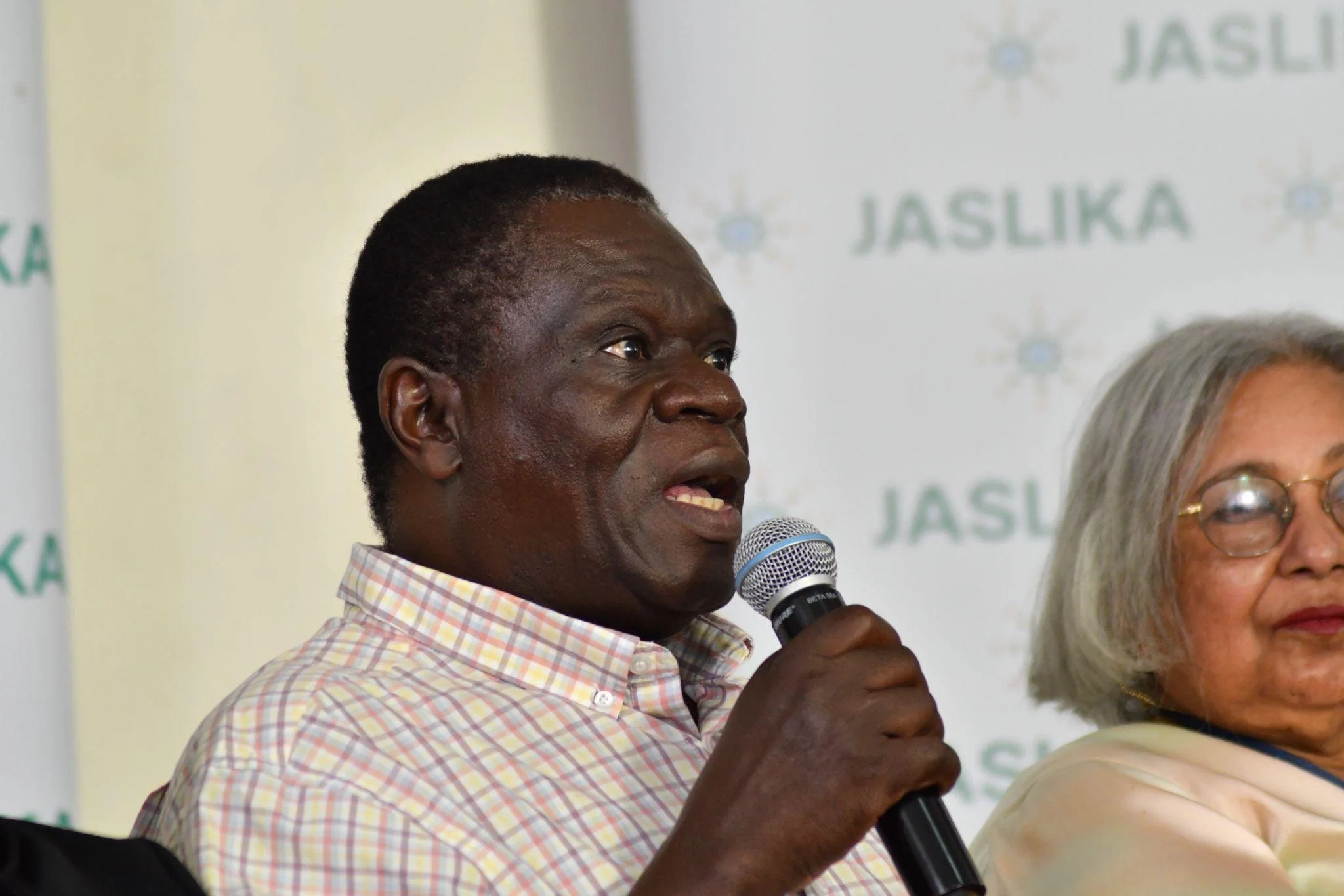 Dr. Okumba Miruka speaking at Jaslika's Beijing +30 and Beyond Fireside Chat