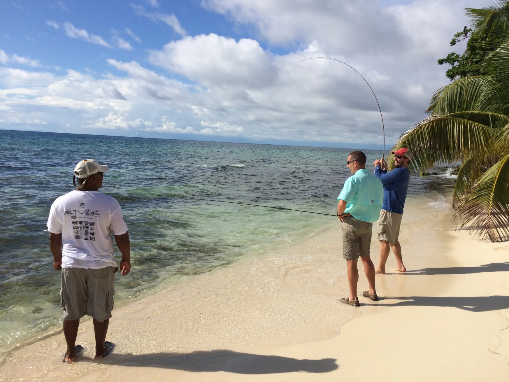 Bonefishing in Belize at the 2015 Gene Families & Isozymes Meeting with, from L-R: our guide, Polo, Jon Oatley (Washington State University), and Chris Geyer (East Carolina University).