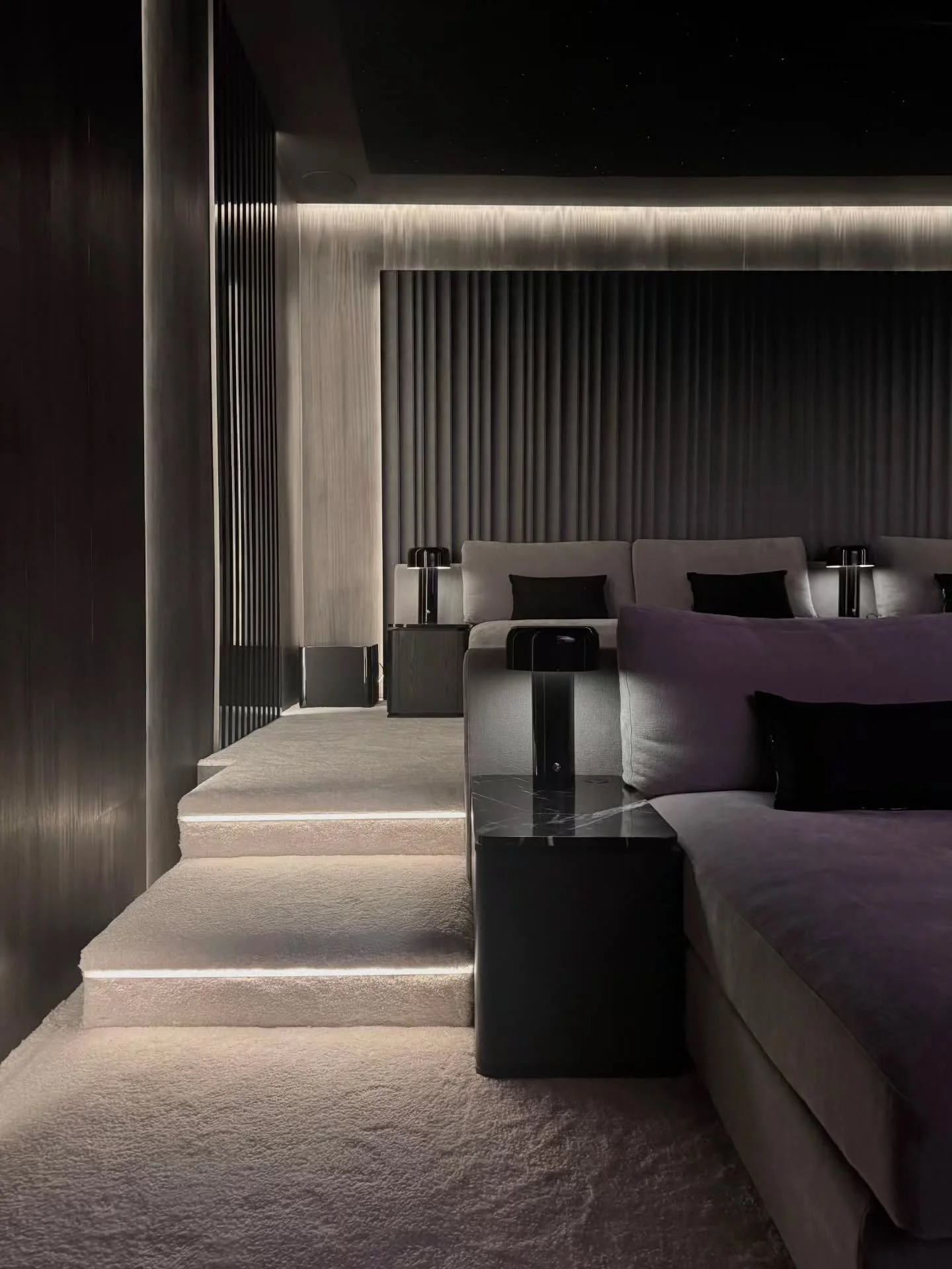 SUNSET MEDIA ROOM

Unwind in a space designed for complete escape. Soft, textured carpeting, custom seating, accent lights and a star-lit ceiling paired with an integrated sound system create the ultimate setting to sit back, relax, and get lost in t