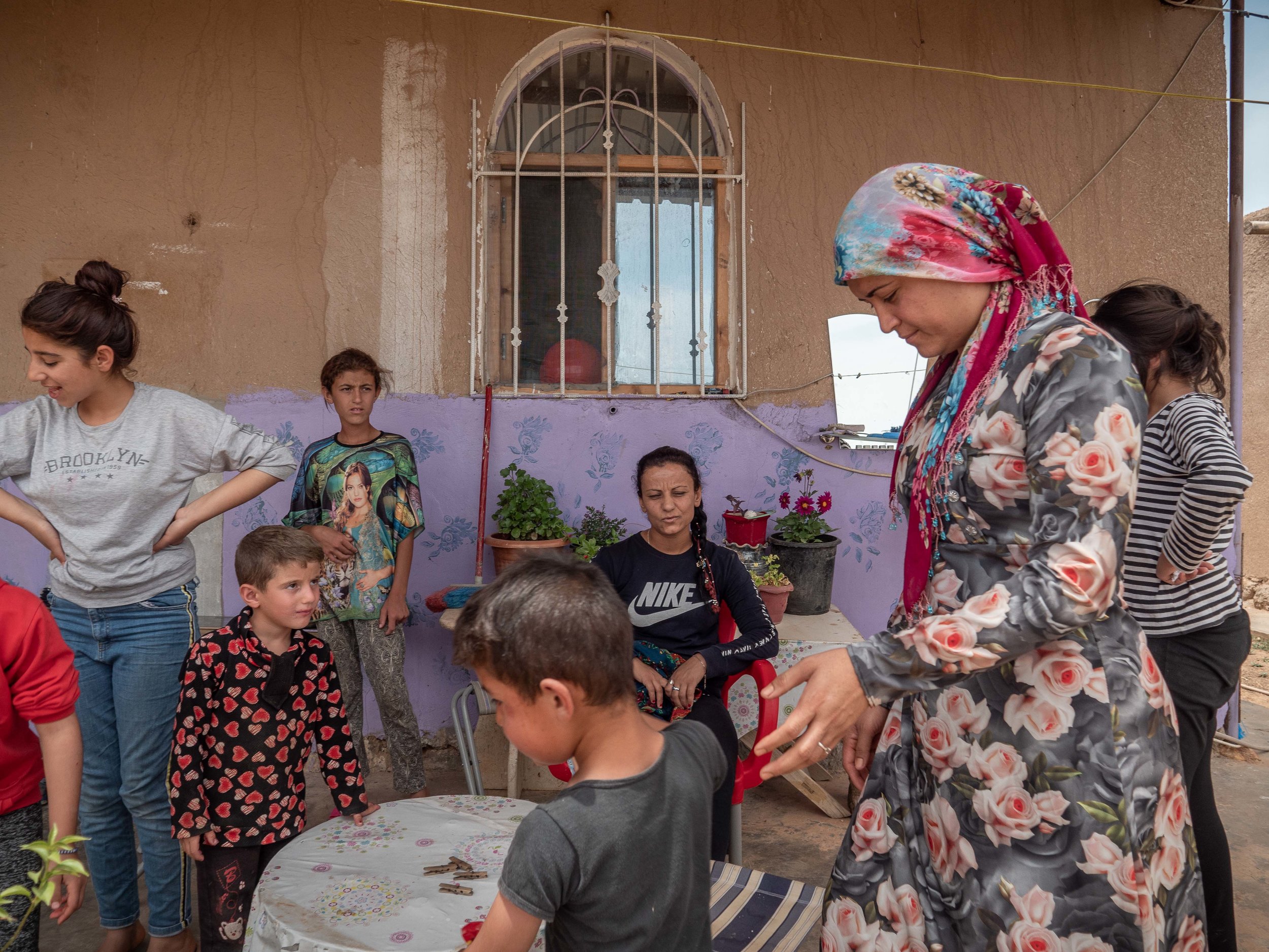 31/05/19, Jinwar, Syria - A group of women and their children in Jinwar. only women are allowed to live in the village of Jinwar, who was founded to give shelter to widows and women who suffered domestic violence.