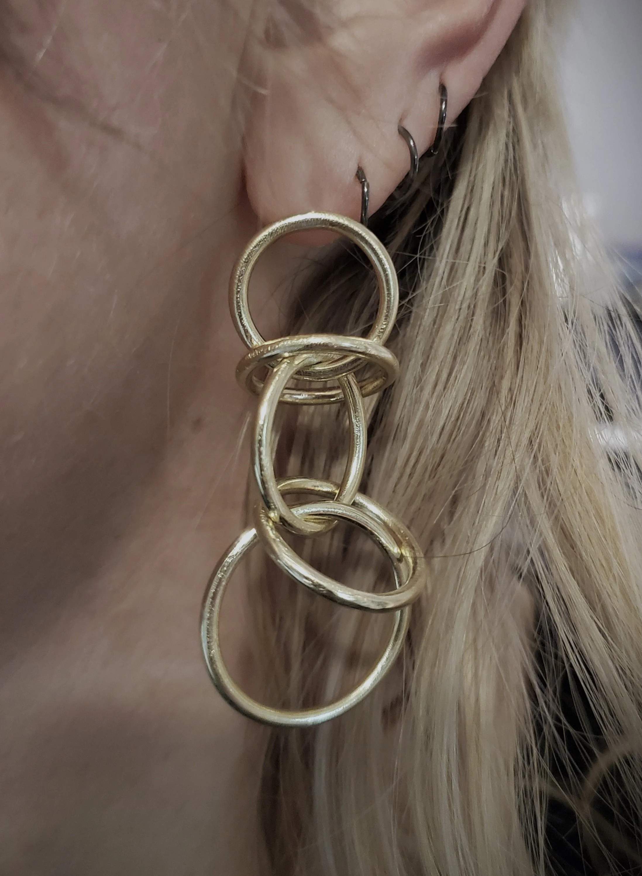 Orbit+earrings+brass+large+WORN.jpg