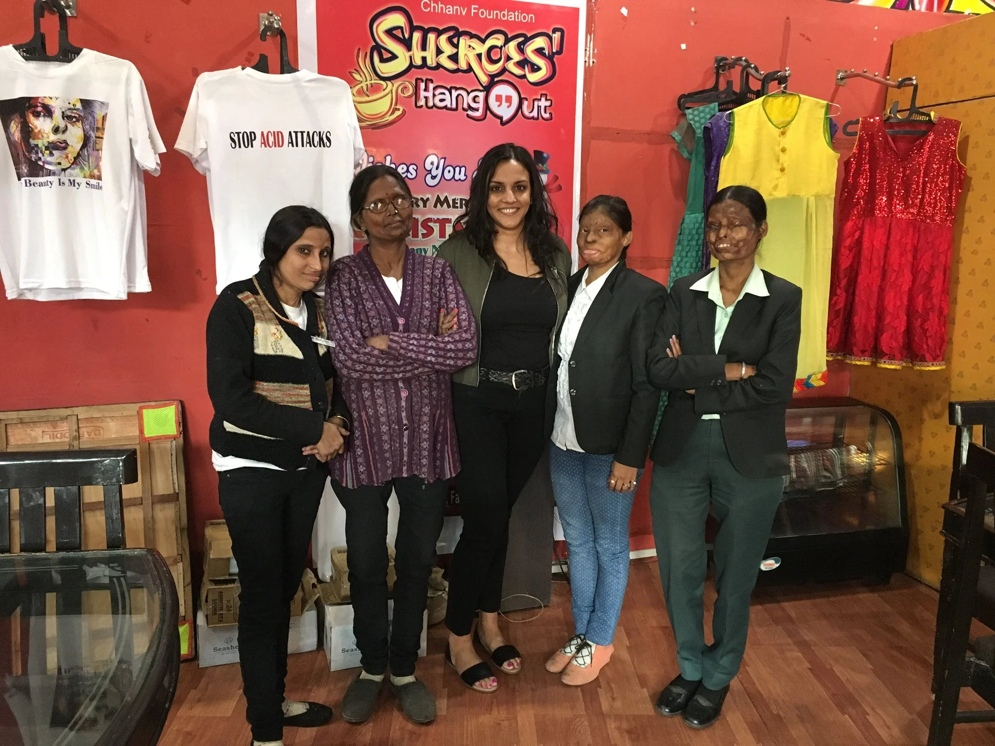  We took a group photo in front of Rupa's fashion "boutique" on the right and the tshirts for sale to raise money for the organization. I happen to be wearing the shirt as I write this post. 