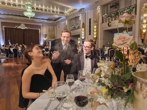 Corporate event guests reacting to magician Matthew Garrett at Sheraton Grand London