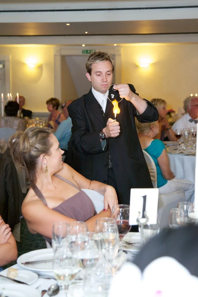 Wedding guests enjoying close-up magic
