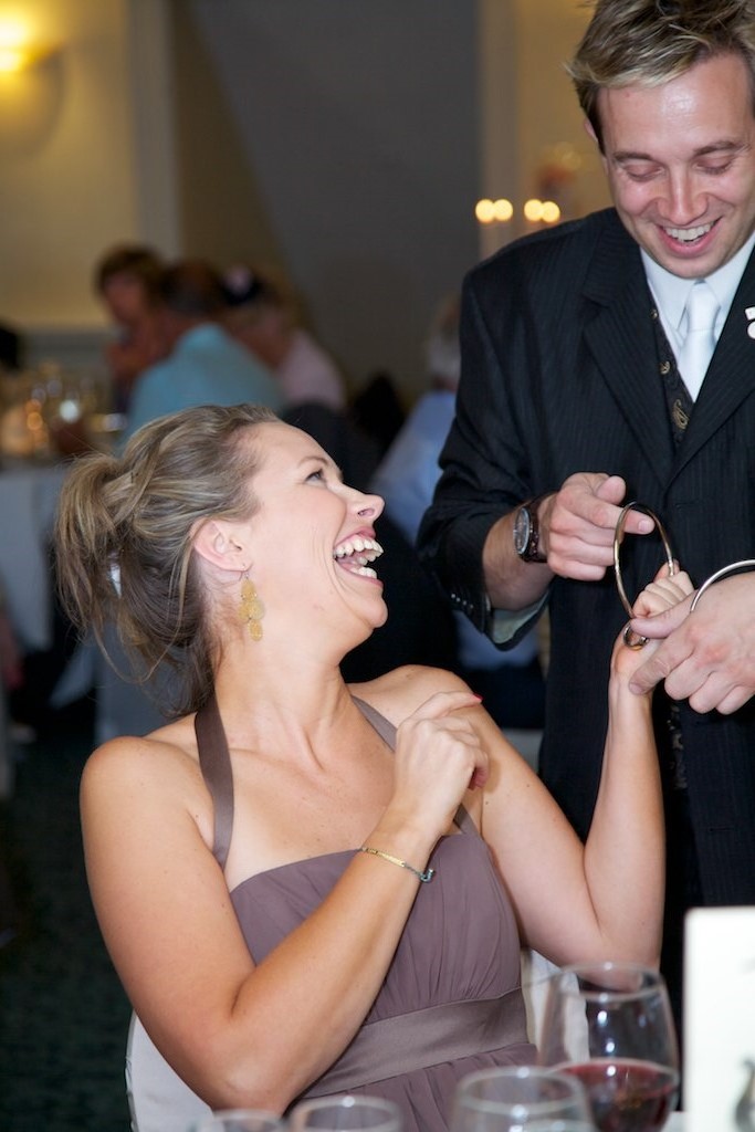 Wedding magician entertaining guests