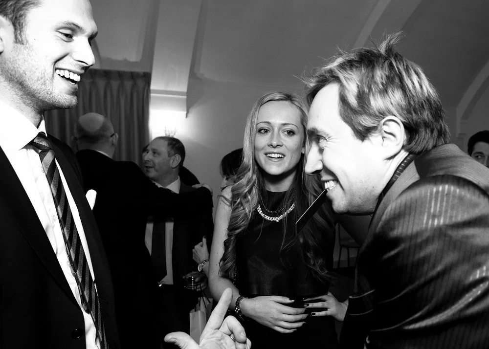 Guests reacting to Matthew Garrett performing close-up magic