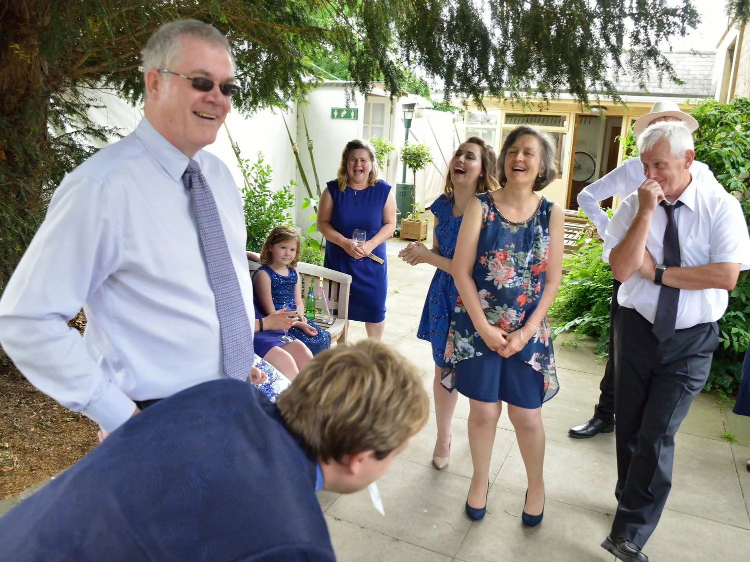 Wedding magician entertaining guests at a wedding reception