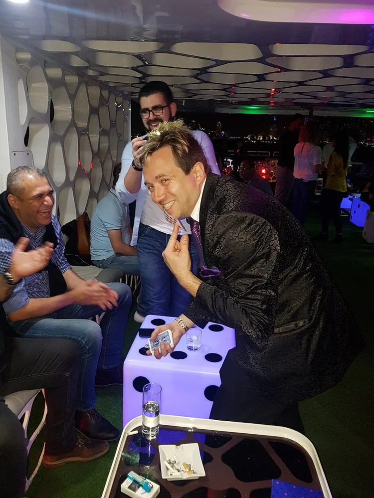 Close-up magician performing for guests