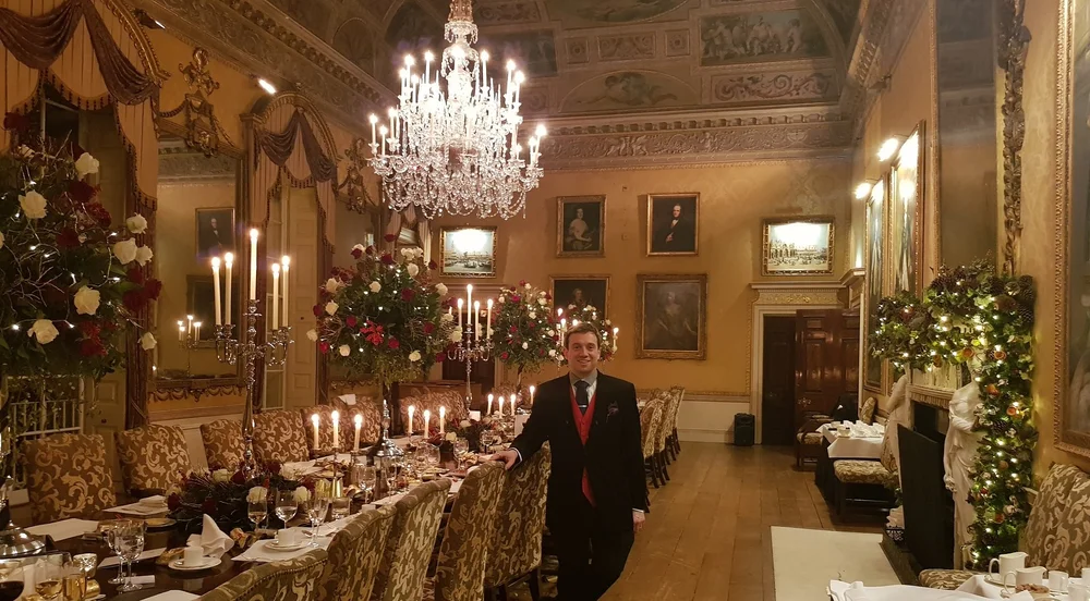 Professional table magician Matthew Garrett entertaining guests at a formal dinner