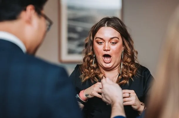 Guests reacting to Matthew Garrett's close-up magic in Derby