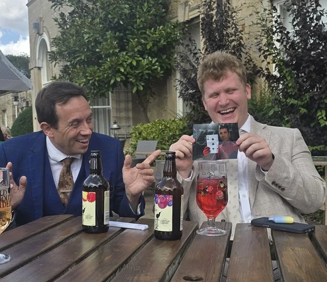 Guest reacting to close-up magician Matthew Garrett at Barton Hall in Kettering