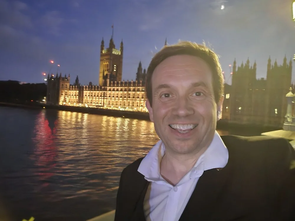 Matthew Garrett performing as a magician at the Houses of Parliament in Westminster London