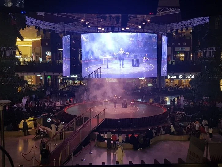 Matthew Garrett performing on stage at an Ooredoo New Year's Eve event in Qatar