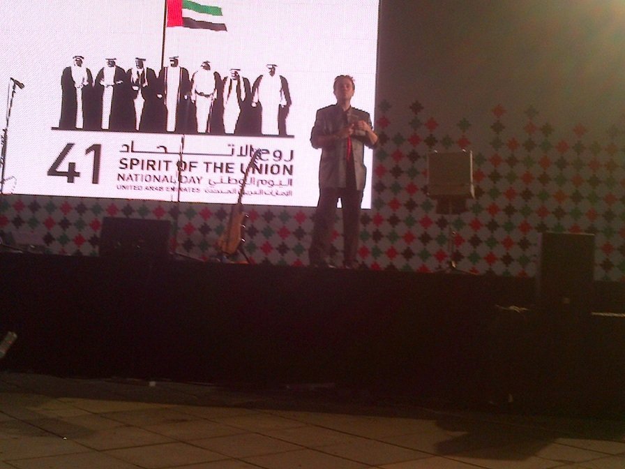 Matthew Garrett performing magic on stage at the UAE 41st National Day celebrations in Abu Dhabi