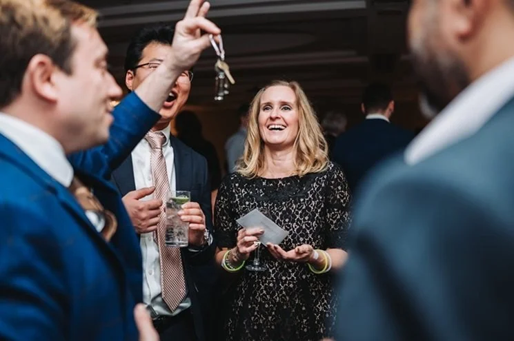 Wedding guests reacting to close-up magic
