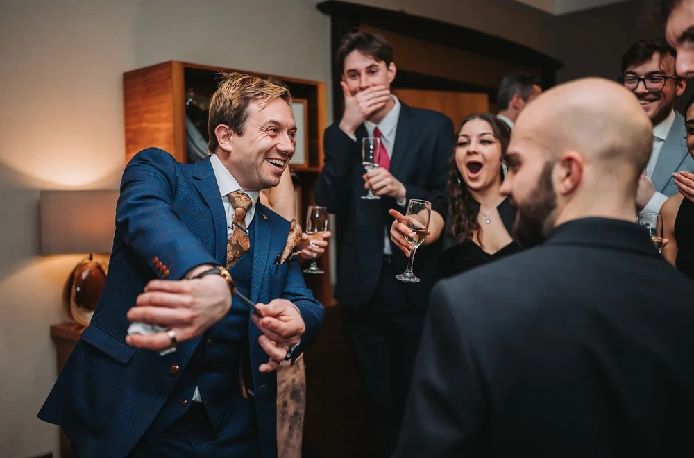 Guests enjoying close-up magic performed by Matthew Garrett in Ipswich
