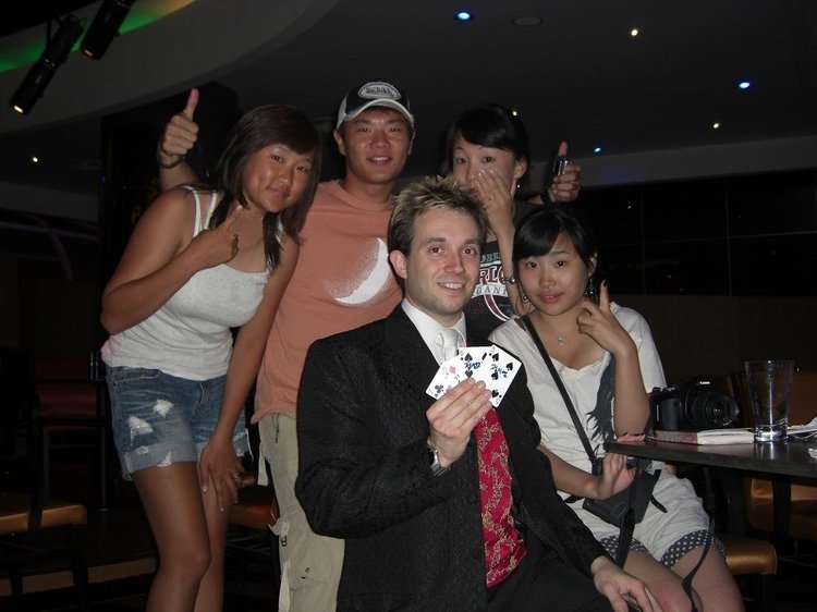 Matthew Garrett performing close-up magic for international guests at Kempinski Hotel Dubai