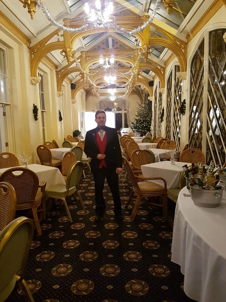 Matthew Garrett entertaining guests at an event at Orton Hall Hotel Peterborough