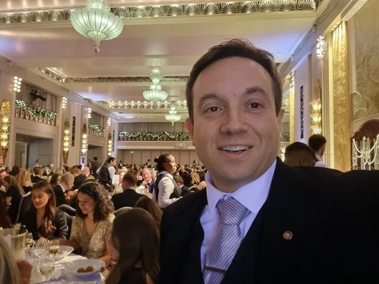 Audience reaction to magician Matthew Garrett at a London corporate event