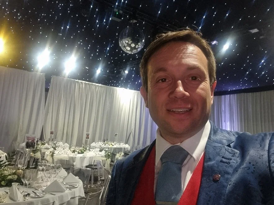 Wedding guests enjoying Matthew Garrett's close-up magic at Kesgrave Hall near Ipswich