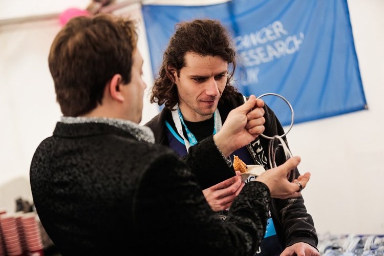 Matthew Garrett magician at Cancer Research event in Trafalgar Square London
