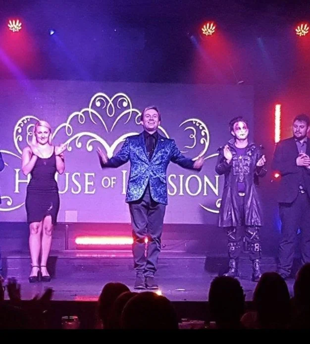 Matthew Garrett performing a stage magic show
