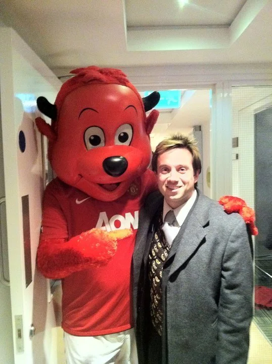 Matthew Garrett at a Manchester United event with the Aon mascot