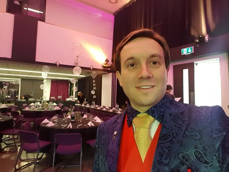 Matthew Garrett performing close-up magic at an event at 96 Shenley Road near St Albans